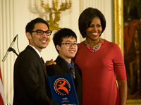 Photo of Joshua Heim, King Lau, and Michelle Obama